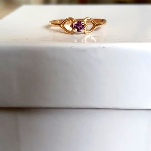 10k solid gold ring with purple stone.